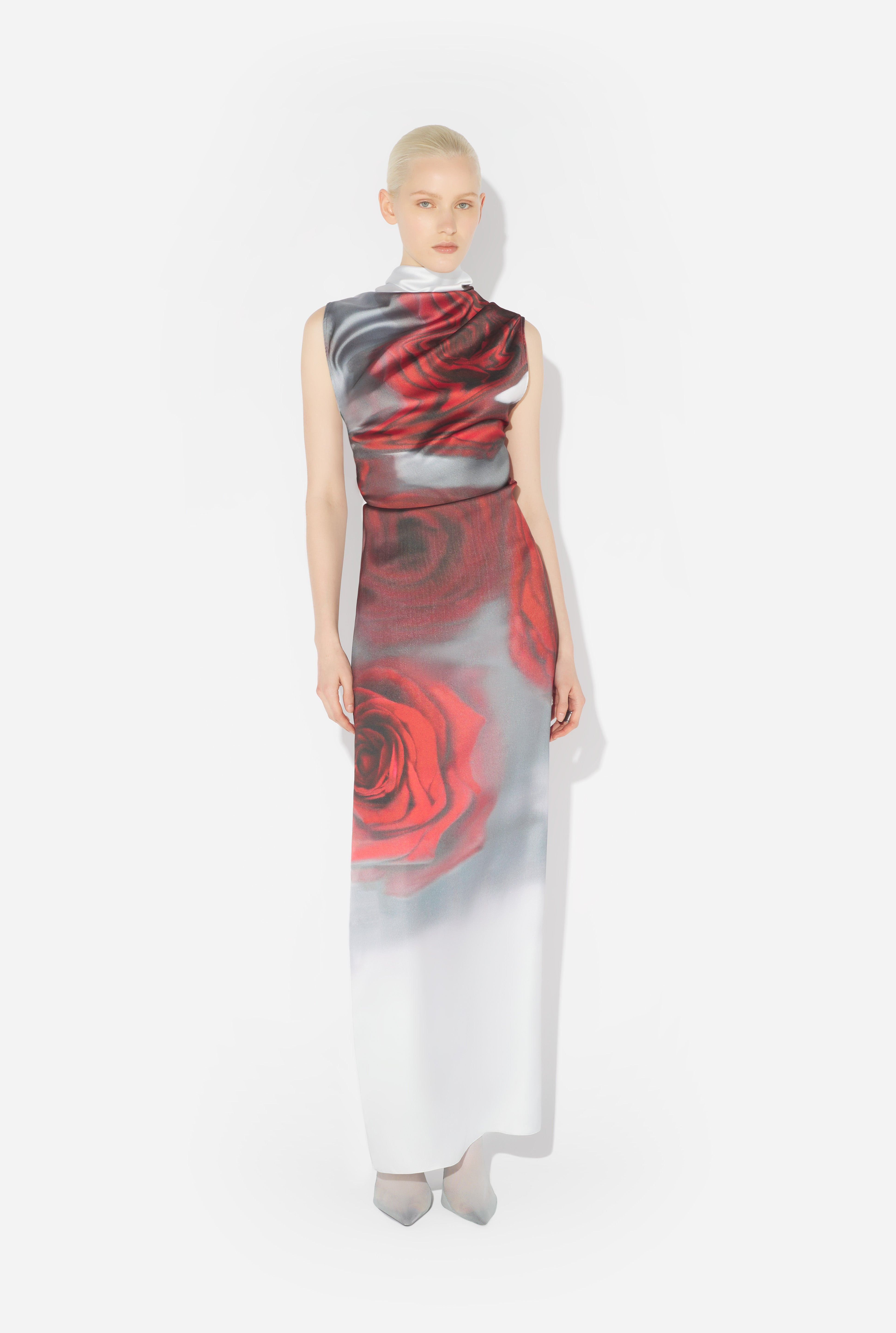 the red draped blurry roses dress